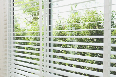 Venetian blinds by the window
